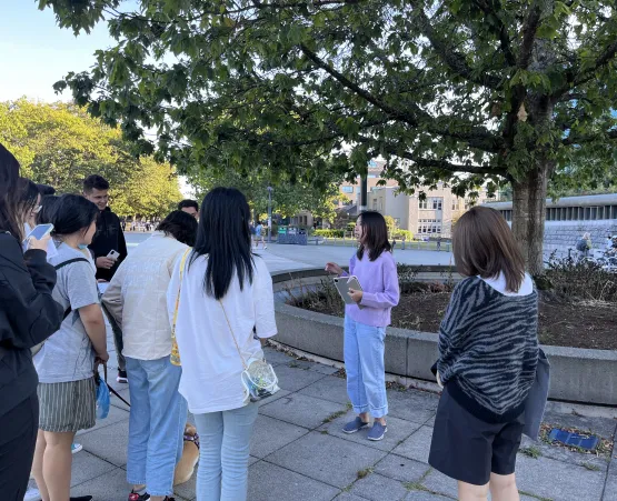 Group of students outside under a tree