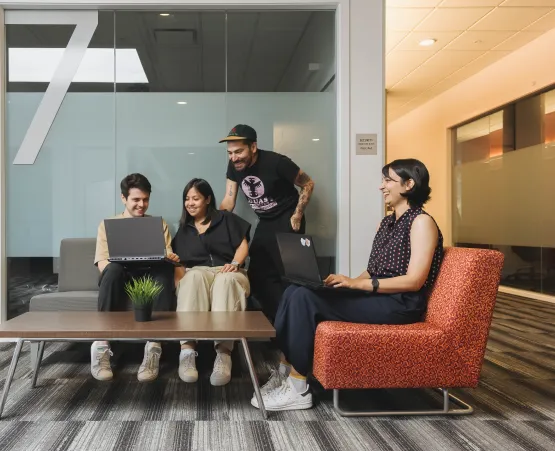 Students collaborating sitting on couches